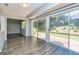 View of the backyard through sliding glass doors, revealing a well-manicured yard at 105 Lake Forest Drive, Peachtree City, GA 30269