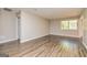 Living room with new flooring, a window, and neutral paint at 105 Lake Forest Drive, Peachtree City, GA 30269