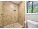 The walk-in shower features updated tile, a shower head, and a storage nook at 105 Lake Forest Drive, Peachtree City, GA 30269