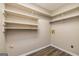 Walk-in storage room with shelving and new flooring at 105 Lake Forest Drive, Peachtree City, GA 30269
