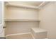 A walk-in closet provides ample storage space with shelving and room for organization at 105 Lake Forest Drive, Peachtree City, GA 30269