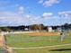 Community baseball field with well-maintained grounds, fencing, and bright lighting at 234 Thyme Leaf Way, Locust Grove, GA 30248