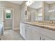Bright bathroom with double sinks, granite countertop, a tub, and a glass enclosed shower at 234 Thyme Leaf Way, Locust Grove, GA 30248