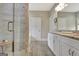 Bright bathroom with a glass shower, a separate tub, and a vanity with granite counters at 234 Thyme Leaf Way, Locust Grove, GA 30248