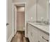Bathroom features a granite countertop, a white vanity, and an open doorway to the shower at 234 Thyme Leaf Way, Locust Grove, GA 30248
