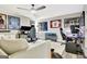 Bonus room with multiple gaming stations and a cozy seating area at 234 Thyme Leaf Way, Locust Grove, GA 30248