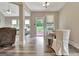 Dining room area with open access to the backyard through a glass door and big bright windows at 234 Thyme Leaf Way, Locust Grove, GA 30248