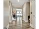Inviting entryway showcasing hardwood floors and an open floor plan into a spacious living area at 234 Thyme Leaf Way, Locust Grove, GA 30248