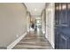 Inviting entryway featuring beautiful floors, neutral paint, and an open floor plan, leading to the living spaces at 234 Thyme Leaf Way, Locust Grove, GA 30248