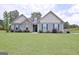 Charming single-Gathering home featuring a well-maintained lawn and stone accents at 234 Thyme Leaf Way, Locust Grove, GA 30248