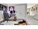 View of the gaming area with a modern desk and comfortable gaming chair at 234 Thyme Leaf Way, Locust Grove, GA 30248