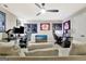 Spacious game room with comfortable seating, a ceiling fan, and modern decor at 234 Thyme Leaf Way, Locust Grove, GA 30248