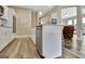Kitchen island features stainless steel dishwasher, white cabinets, granite countertops and an open concept at 234 Thyme Leaf Way, Locust Grove, GA 30248