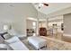 Open living area with hardwood floors, leading to the dining and kitchen areas, with comfortable seating at 234 Thyme Leaf Way, Locust Grove, GA 30248