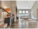 Bright living room features a vaulted ceiling, stone fireplace, and large windows with natural light at 234 Thyme Leaf Way, Locust Grove, GA 30248