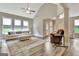 Spacious living room with vaulted ceilings, hardwood floors, and comfortable seating arrangement at 234 Thyme Leaf Way, Locust Grove, GA 30248