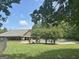 Inviting outdoor pool area with covered pavilion and mature trees in a lovely community at 234 Thyme Leaf Way, Locust Grove, GA 30248
