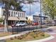Downtown street view with sidewalks, street lamps, and colorful storefronts at 234 Thyme Leaf Way, Locust Grove, GA 30248