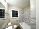 Bathroom featuring granite countertops and new shower with nice tiling at 2239 Nelms Sw Dr, Atlanta, GA 30315