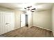 Bedroom featuring neutral paint, plush carpet, and closet with double doors at 2239 Nelms Sw Dr, Atlanta, GA 30315