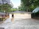 Charming single-story home with freshly painted exterior and inviting front entrance with wood stairs at 2239 Nelms Sw Dr, Atlanta, GA 30315