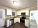 Modern kitchen featuring white cabinets, stainless steel appliances, and granite countertops at 2239 Nelms Sw Dr, Atlanta, GA 30315