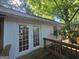 Back deck featuring wooden railings and access to the home's interior at 1150 Goldsmith Rd, Stone Mountain, GA 30083