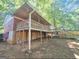 Home back exterior with deck, staircase, and lawn at 1150 Goldsmith Rd, Stone Mountain, GA 30083
