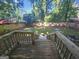 Spacious backyard with mature trees and wooden fence at 1150 Goldsmith Rd, Stone Mountain, GA 30083