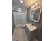 Bathroom featuring shower and vanity with modern finishes at 1150 Goldsmith Rd, Stone Mountain, GA 30083