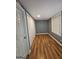 Bedroom featuring neutral paint, hardwood floors, closet, and natural light at 1150 Goldsmith Rd, Stone Mountain, GA 30083