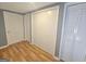 Bedroom featuring neutral paint, hardwood floors, and closet for plenty of storage at 1150 Goldsmith Rd, Stone Mountain, GA 30083