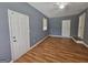 Bonus room with hardwood flooring and multiple doors and windows at 1150 Goldsmith Rd, Stone Mountain, GA 30083