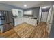 Well lit kitchen featuring a stainless steel refrigerator and white cabinetry at 1150 Goldsmith Rd, Stone Mountain, GA 30083