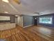 Open living area with hardwood floors, neutral walls, and a ceiling fan at 1150 Goldsmith Rd, Stone Mountain, GA 30083