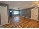 Spacious living room with hardwood floors, neutral walls, and ample natural light at 1150 Goldsmith Rd, Stone Mountain, GA 30083
