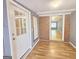 The sunroom is brick-accented and features hardwood floors and a large doorway to another room at 1150 Goldsmith Rd, Stone Mountain, GA 30083