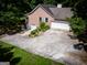 An aerial view of a well-maintained brick home with an attached two-car garage at 1655 Stacia Dr, Covington, GA 30016