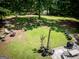 Aerial view of a large backyard with a fire pit and outdoor seating at 1655 Stacia Dr, Covington, GA 30016