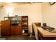 Finished basement area with storage cabinet, desk, and chair, creating a functional workspace at 1655 Stacia Dr, Covington, GA 30016