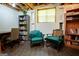 Basement area with finished flooring, natural light, and seating, offering a cozy space for relaxation at 1655 Stacia Dr, Covington, GA 30016
