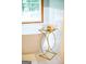 Bright bathroom featuring a modern soaking tub, stylish side table, and tiled floors at 1655 Stacia Dr, Covington, GA 30016