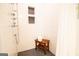 Tiled shower features built-in toiletry shelves and a wood bench seat for added comfort and convenience at 1655 Stacia Dr, Covington, GA 30016