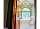 Beautiful bathroom featuring a soaking tub under a large window with natural light at 1655 Stacia Dr, Covington, GA 30016
