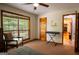 Bedroom with ceiling fan and large window is an ideal space to create a cozy and inspiring atmosphere at 1655 Stacia Dr, Covington, GA 30016