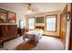 Bright bedroom featuring a ceiling fan, three windows, and neutral walls offers comfort and style at 1655 Stacia Dr, Covington, GA 30016