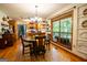 Open concept dining area connected to kitchen, offering hardwood floors and large windows at 1655 Stacia Dr, Covington, GA 30016