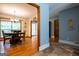 Dining area connected to the kitchen and various rooms featuring hardwood floors at 1655 Stacia Dr, Covington, GA 30016