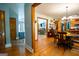 Dining Room view showcasing hardwood floors, open floor plan, and lots of natural light at 1655 Stacia Dr, Covington, GA 30016