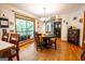 Bright dining room with hardwood floors, a chandelier, and large window at 1655 Stacia Dr, Covington, GA 30016